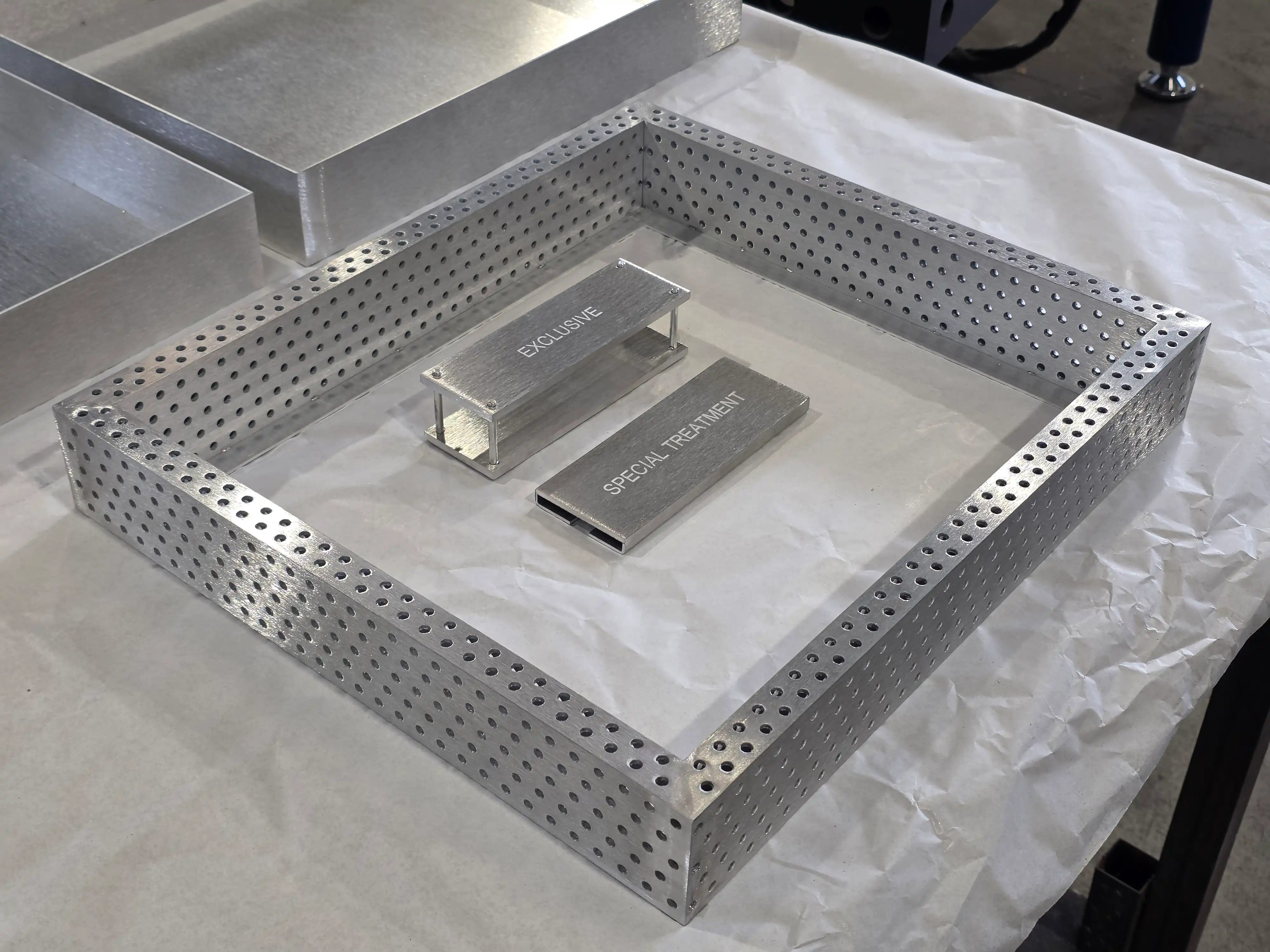 Aluminum components, perforated tubes, and frames processed with laser cutting and marking