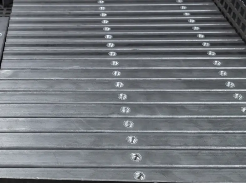 Batch processing of round iron tubes subjected to drilling and tapping